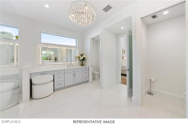 ensuite bathroom featuring toilet, baseboards, visible vents, and recessed lighting