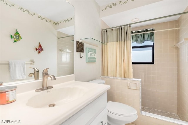 bathroom with vanity, a shower with curtain, and toilet