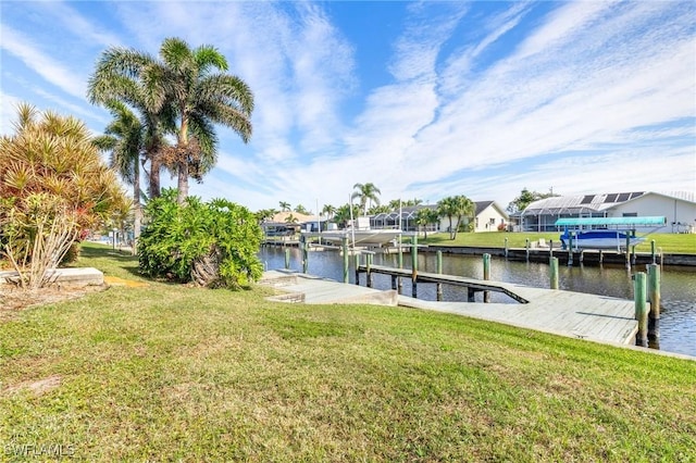 dock area featuring a yard and a water view