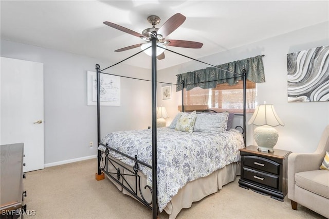 bedroom featuring ceiling fan and light colored carpet