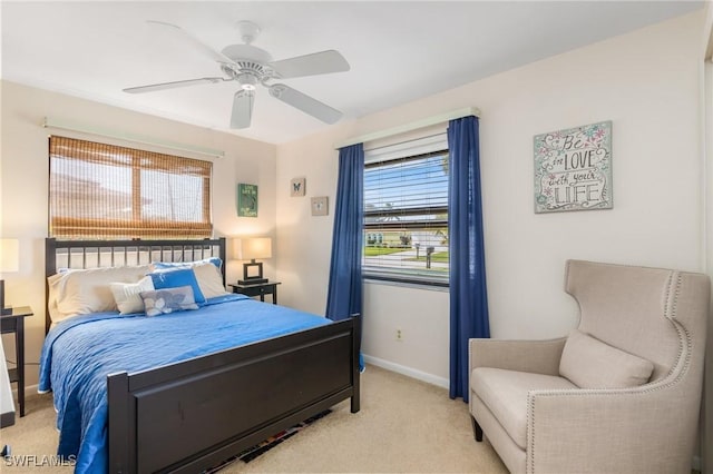 bedroom with ceiling fan and light colored carpet