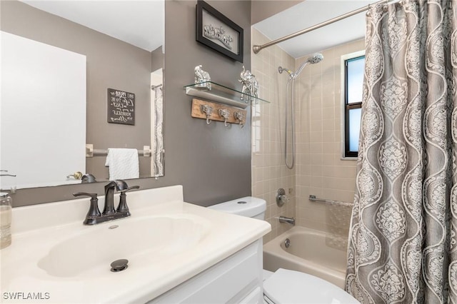 full bathroom with shower / bath combo, vanity, and toilet