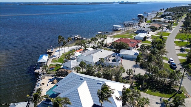 birds eye view of property with a water view