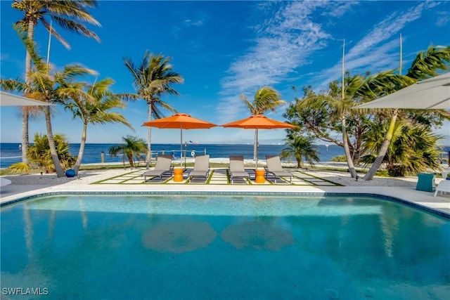 view of pool featuring a water view