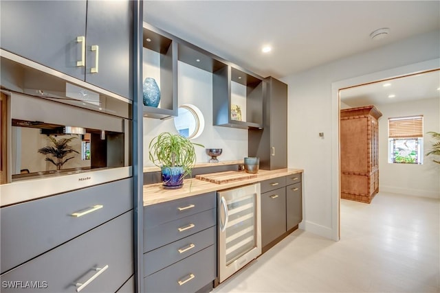 kitchen featuring gray cabinetry and wine cooler