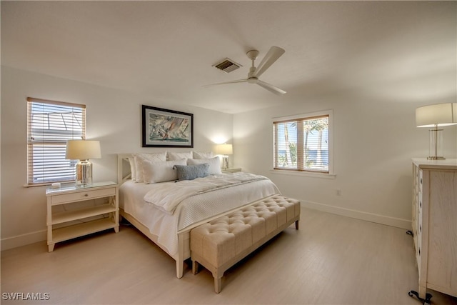 bedroom featuring light hardwood / wood-style floors and ceiling fan