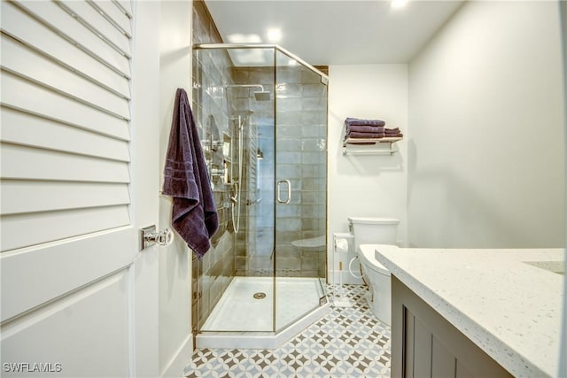 bathroom with toilet and an enclosed shower