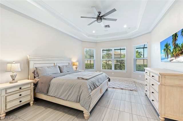 bedroom featuring ceiling fan, ornamental molding, and a raised ceiling