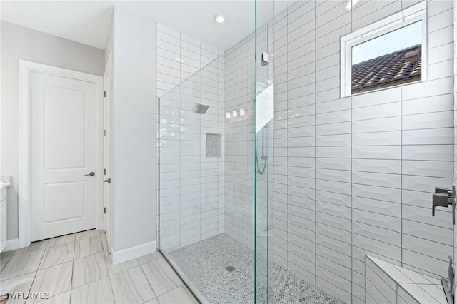 bathroom featuring a tile shower