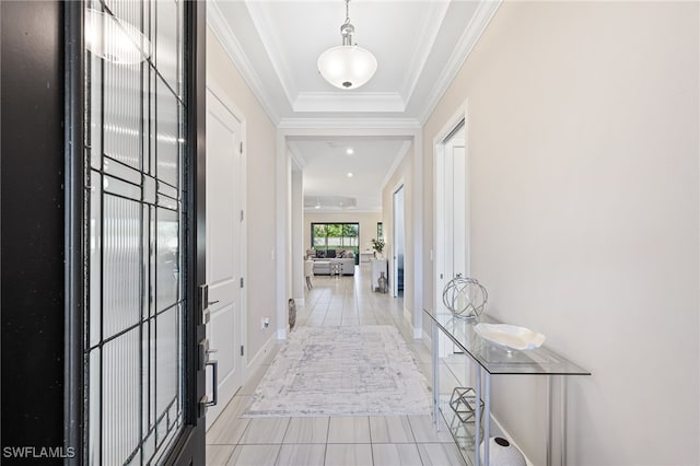 hall with light tile patterned flooring and crown molding