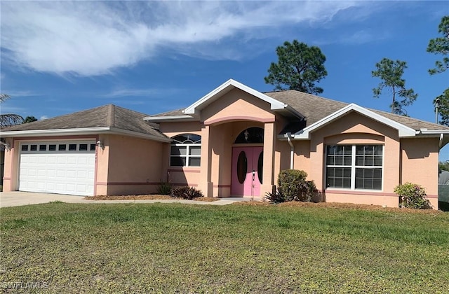 single story home featuring a garage and a front yard