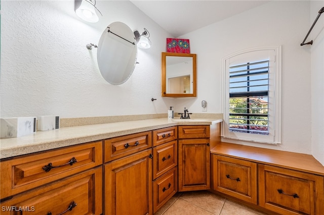 bathroom with tile patterned flooring and vanity