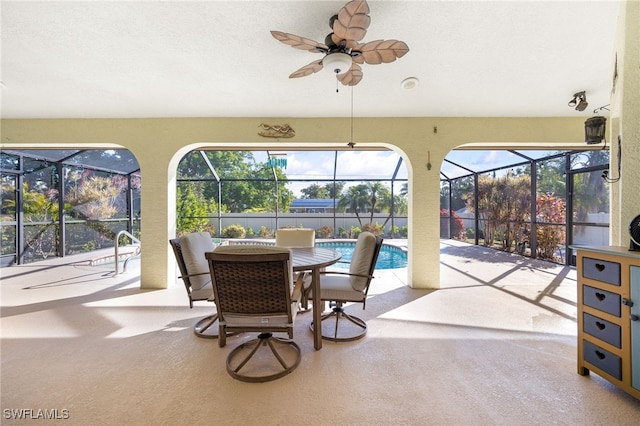 sunroom with a ceiling fan