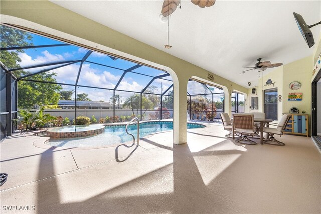 view of pool featuring a patio, a lanai, and an in ground hot tub