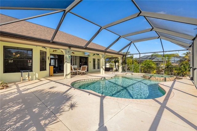 view of pool featuring a patio, ceiling fan, and glass enclosure