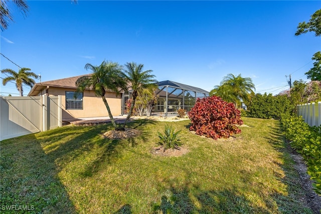 view of yard featuring a lanai