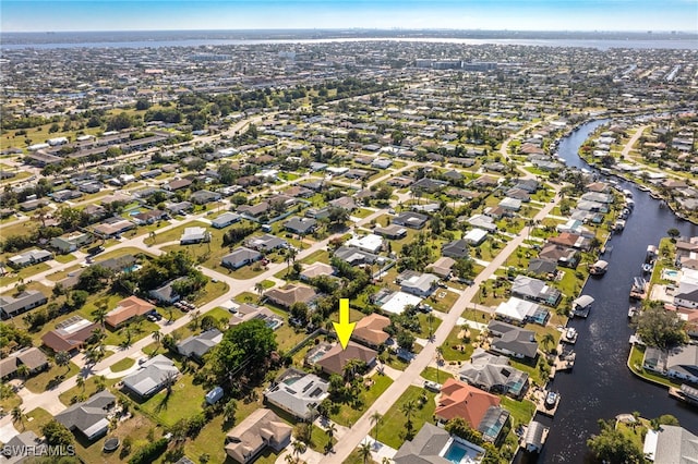 aerial view featuring a water view and a residential view