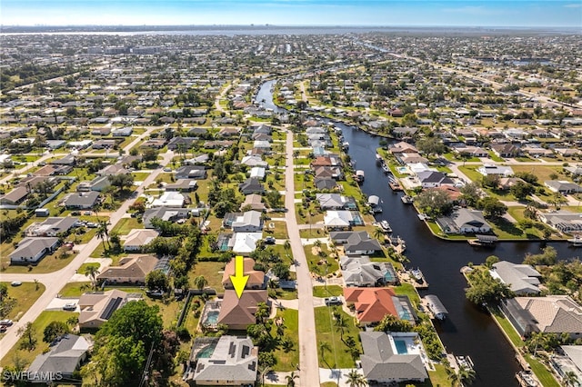 bird's eye view with a water view and a residential view