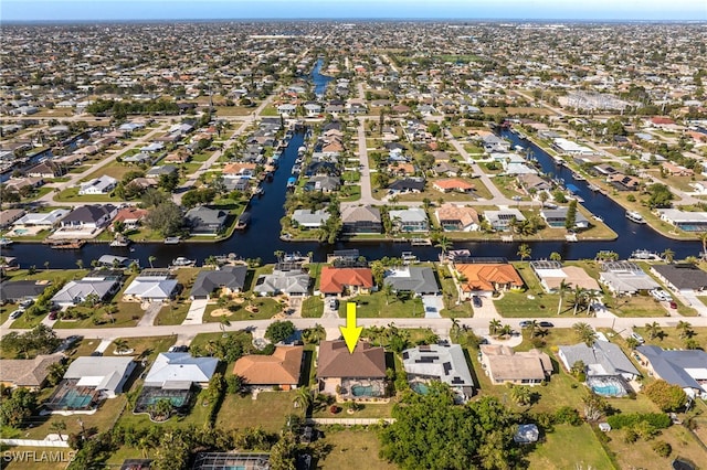 bird's eye view with a residential view and a water view