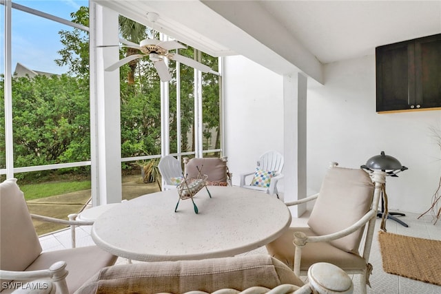 sunroom featuring ceiling fan