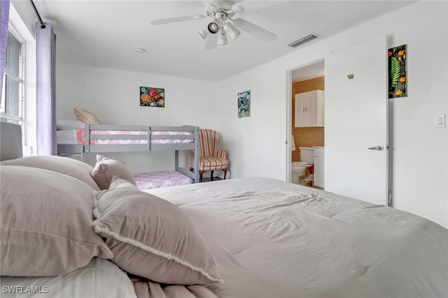 bedroom featuring ceiling fan and ensuite bathroom