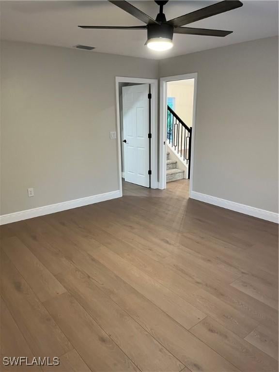 unfurnished room featuring ceiling fan and light hardwood / wood-style floors