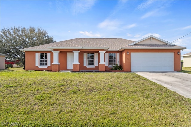 view of front facade featuring a garage and a front lawn