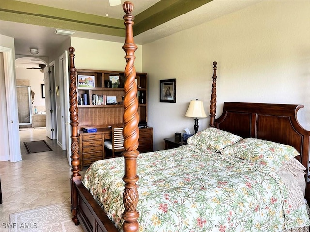 tiled bedroom featuring connected bathroom