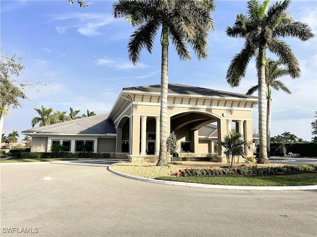 view of building exterior with driveway