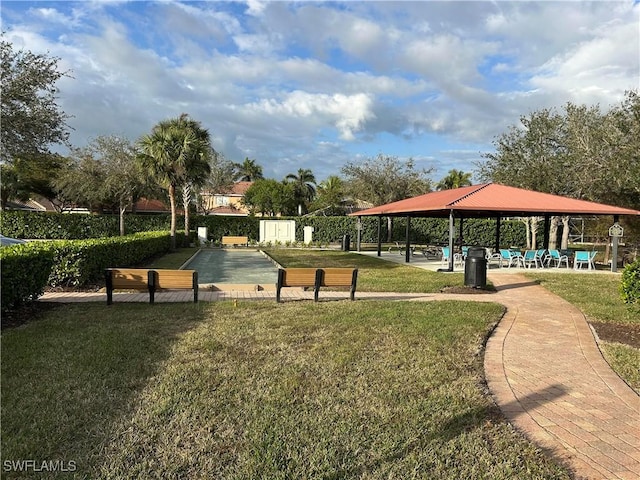 view of property's community featuring a lawn and a gazebo