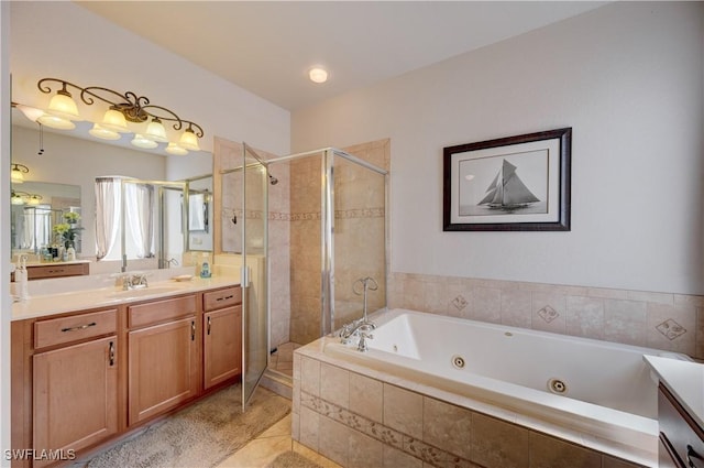 full bathroom with a whirlpool tub, tile patterned floors, a shower stall, and vanity