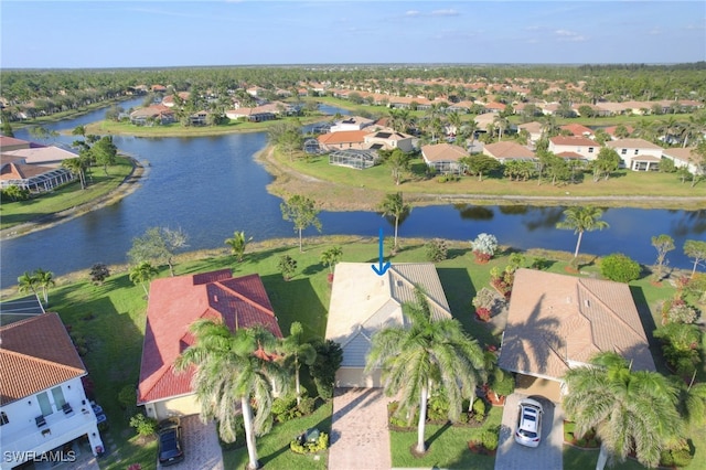 bird's eye view featuring a water view and a residential view