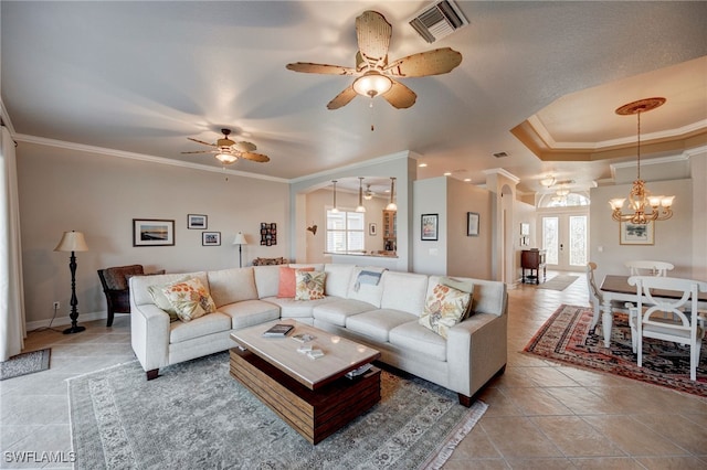 living area with crown molding, light tile patterned floors, visible vents, baseboards, and ceiling fan with notable chandelier