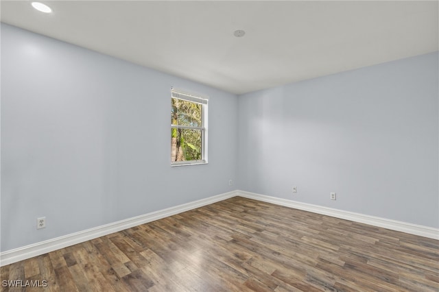 empty room featuring hardwood / wood-style flooring