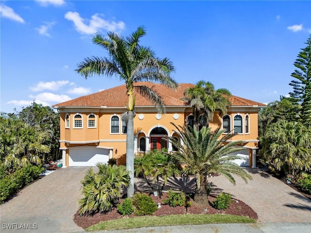 mediterranean / spanish-style house featuring a garage