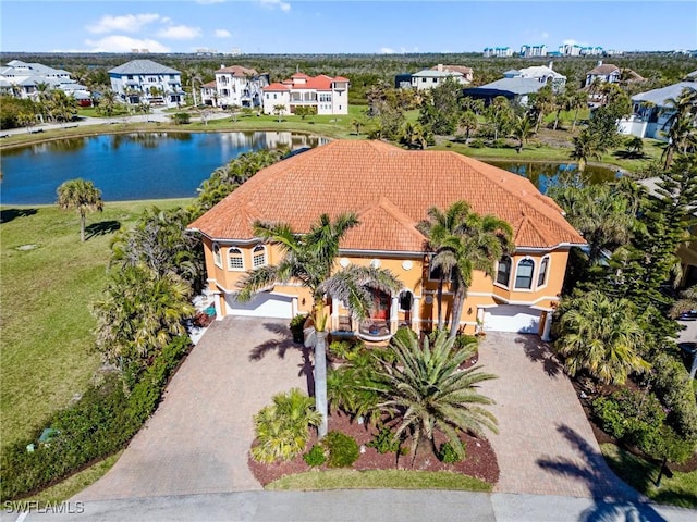 birds eye view of property with a water view