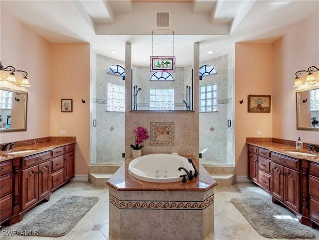 bathroom with vanity, tile patterned floors, and separate shower and tub