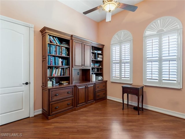 office featuring dark wood-type flooring and ceiling fan