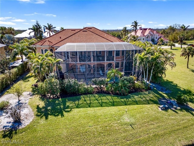 exterior space with a lanai and a front lawn