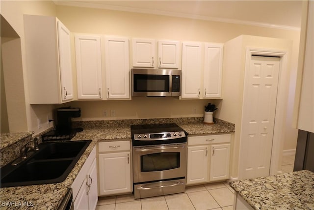 kitchen featuring white cabinetry, appliances with stainless steel finishes, and sink