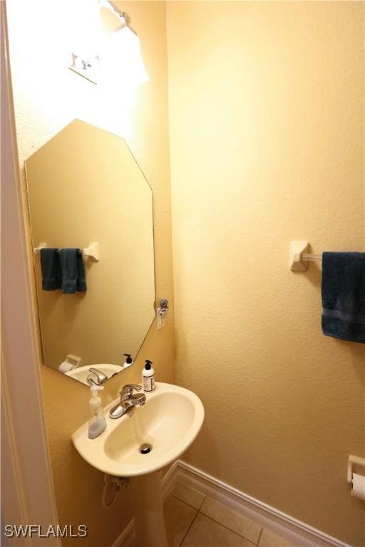 bathroom featuring tile patterned flooring and sink