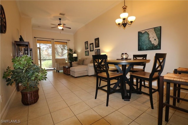 tiled dining space with ornamental molding and ceiling fan with notable chandelier