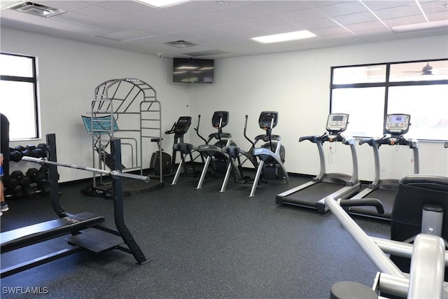 workout area with a paneled ceiling