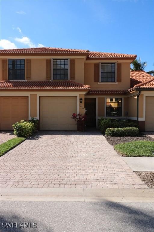 mediterranean / spanish-style home featuring a garage