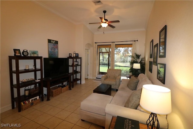 living room with light tile patterned flooring, ceiling fan, and ornamental molding