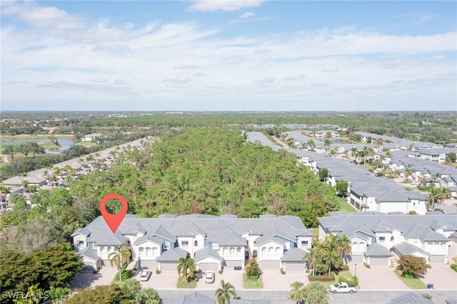 birds eye view of property with a residential view