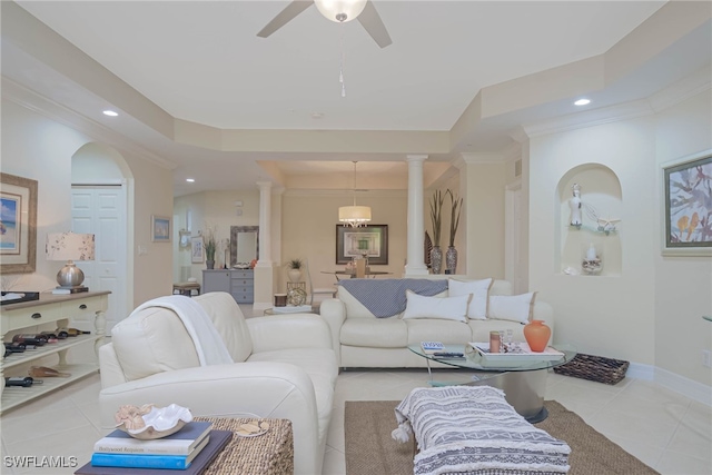 living room featuring ceiling fan, ornamental molding, decorative columns, and light tile patterned floors