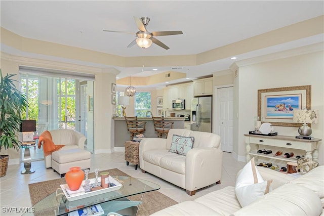 living area featuring light tile patterned flooring, recessed lighting, a ceiling fan, and baseboards