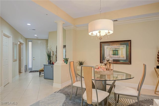 dining space with decorative columns, baseboards, visible vents, and light tile patterned floors