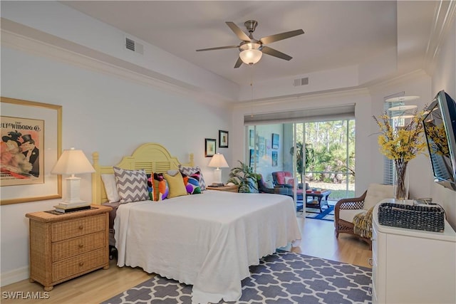 bedroom featuring access to outside, a ceiling fan, visible vents, and light wood finished floors